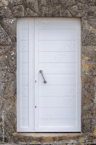 white door in a stone wall