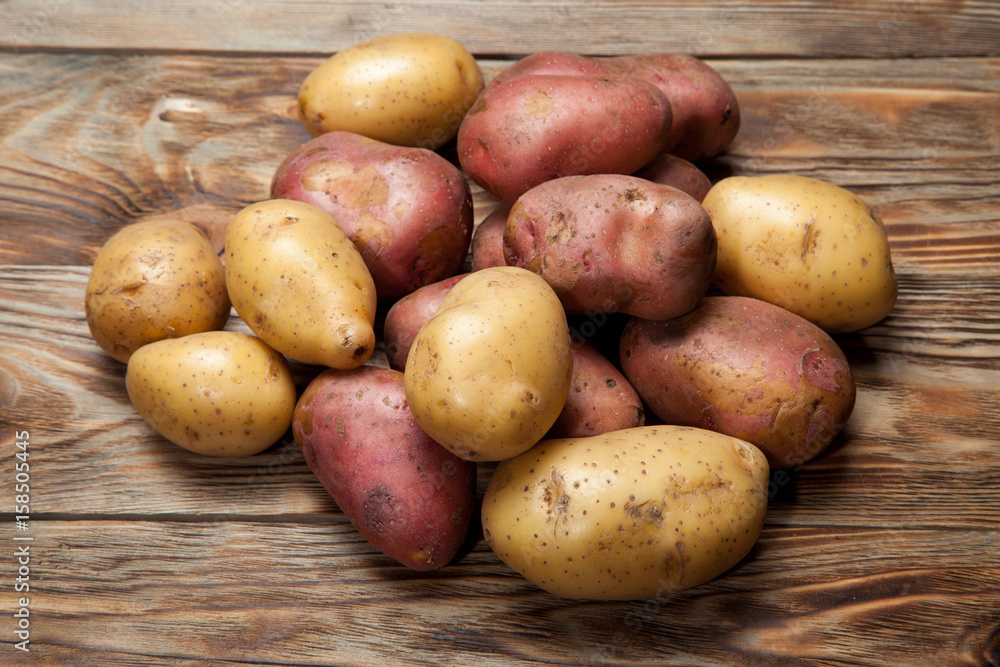 Potatoes on a rustic background Potatoes on a rustic background