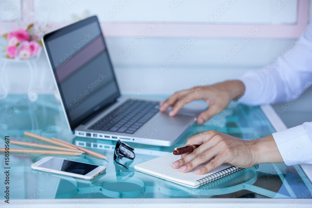 Middle aged businessman working from home using laptop at kitchen table Middle aged businessman working from home using laptop at kitchen table