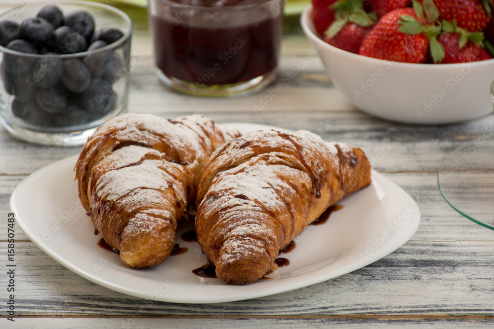 Croissant with chocolate syrup Croissant with chocolate syrup