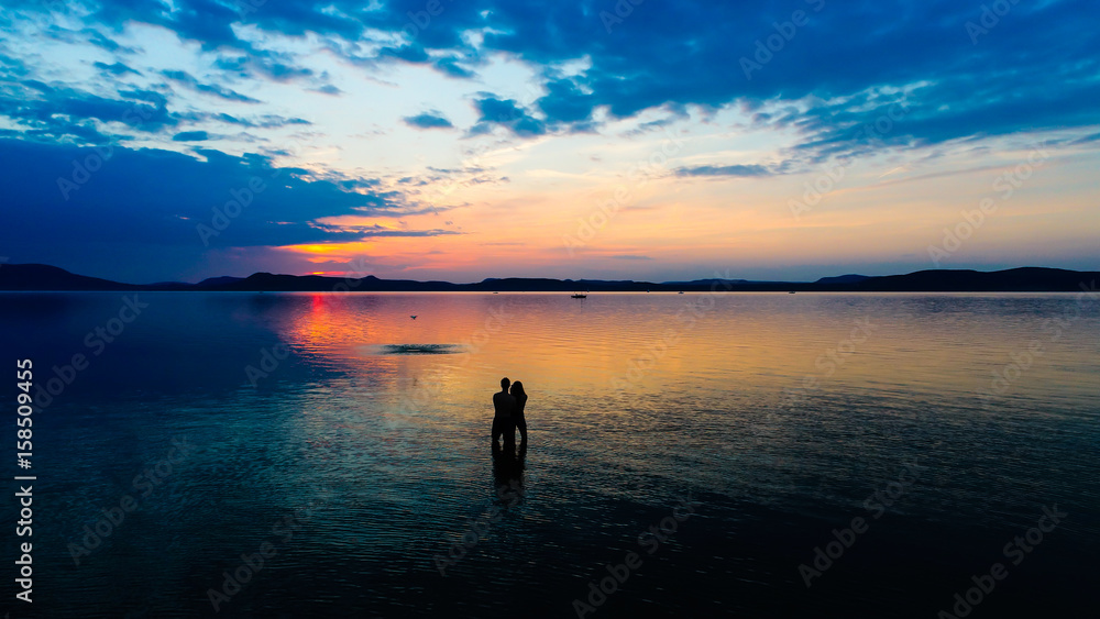 Aeriaal view, Lake Balaton with lovers and drone in the sunset