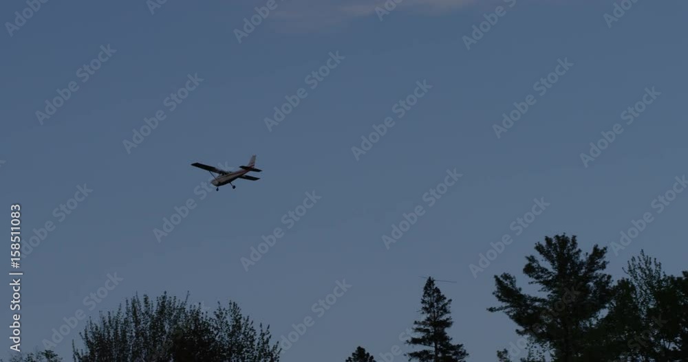 small prop plane dissapears behind trees small prop plane dissapears behind trees