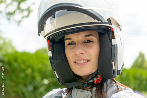 girl with happy face in white helmet with an open visor © Philipimage