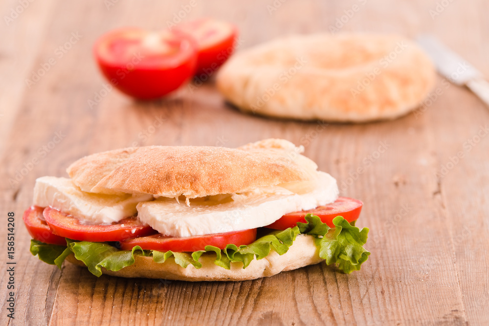 Puccia bread with mozzarella and tomato. Puccia bread with mozzarella and tomato.