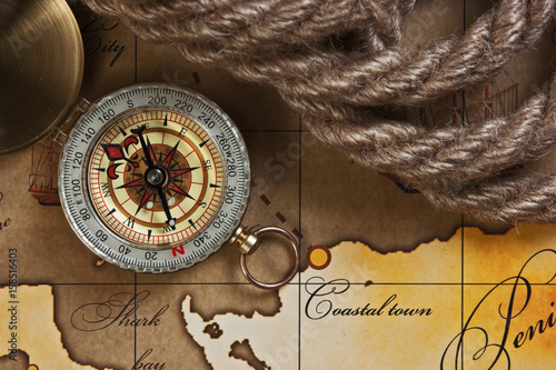 compass and rope on map