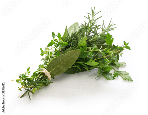 fresh bouquet garni, bunch of herbs isolated on white background photo