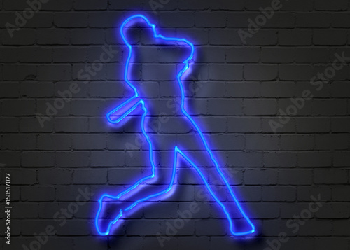 Baseball player, neon sign on brick wall