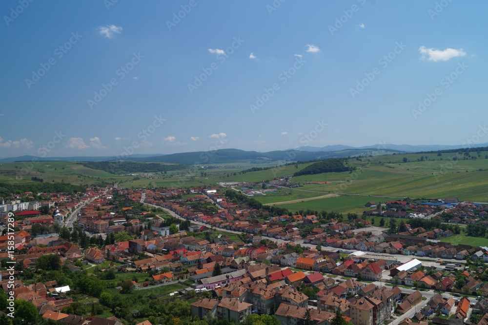 Panorama Rupea city in Transylvania, Brasov, Romania - view from Rupea fortress.
