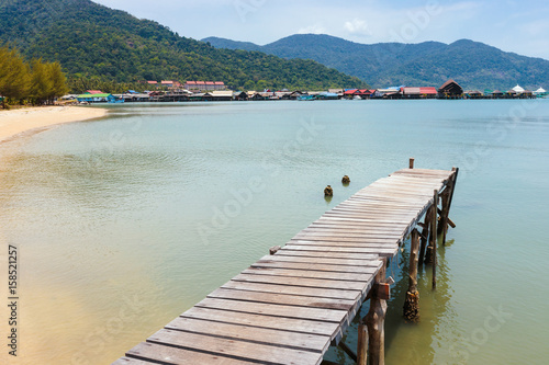 Wooden jetty on exotic beach Koh Chang island  Thailand