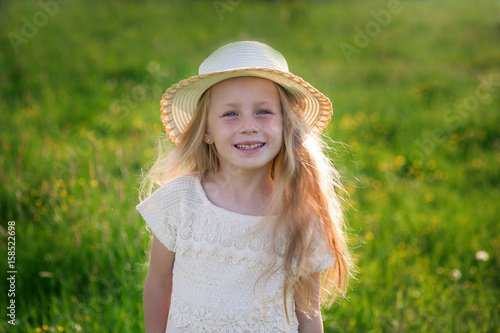Summer portrait of happy cute child in hat