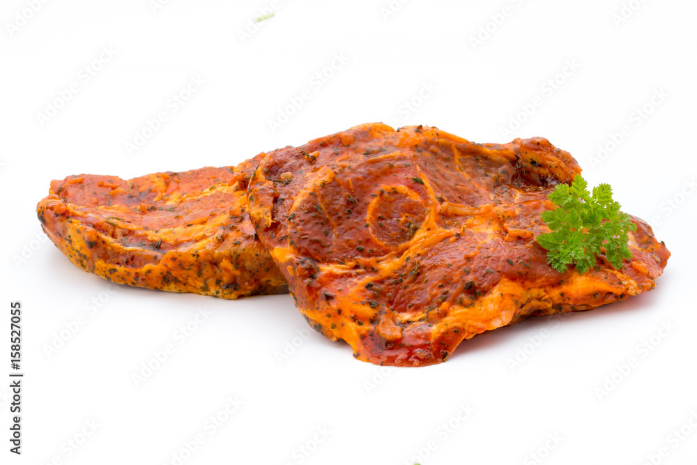 Pork chop, marinated. Isolated on the white background. Pork chop, marinated. Isolated on the white background.