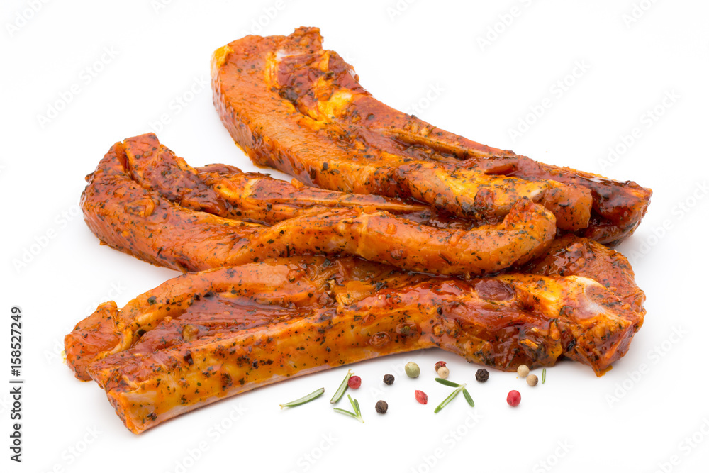 Spicy marinated spare ribs barbecued on the white background. Spicy marinated spare ribs barbecued on the white background.