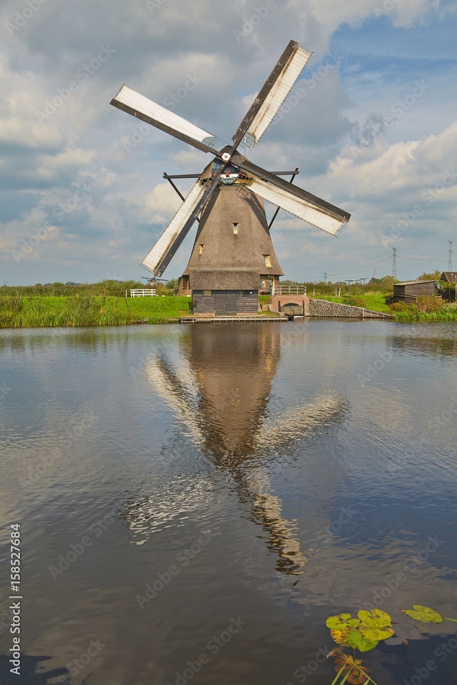 Windmill beside a canal
