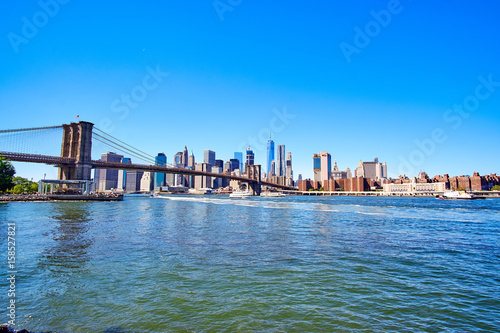 NEW YORK CITY - SEPTEMBER 25: East River with the bridge connecting Brooklyn and Manhattan near the financial district skyline © nielskliim