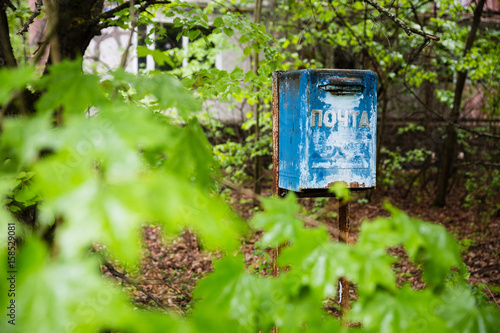 decayed blue ukrainian mailbox in Prypjat