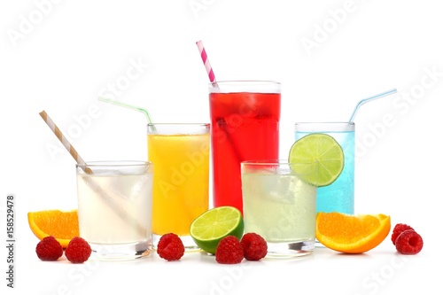 Group of cold colorful summer drinks with fruit isolated on a white background