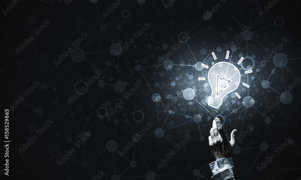 Technology idea concept with glowing bulb icon and touching it f Technology idea concept with glowing bulb icon and touching it f