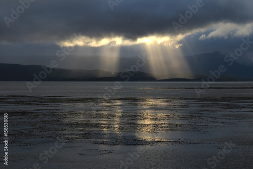Beagle Channel with beautiful atmosphere of clouds and sun, Tierra del Fuego, Ushuaia, Argentina © reisegraf