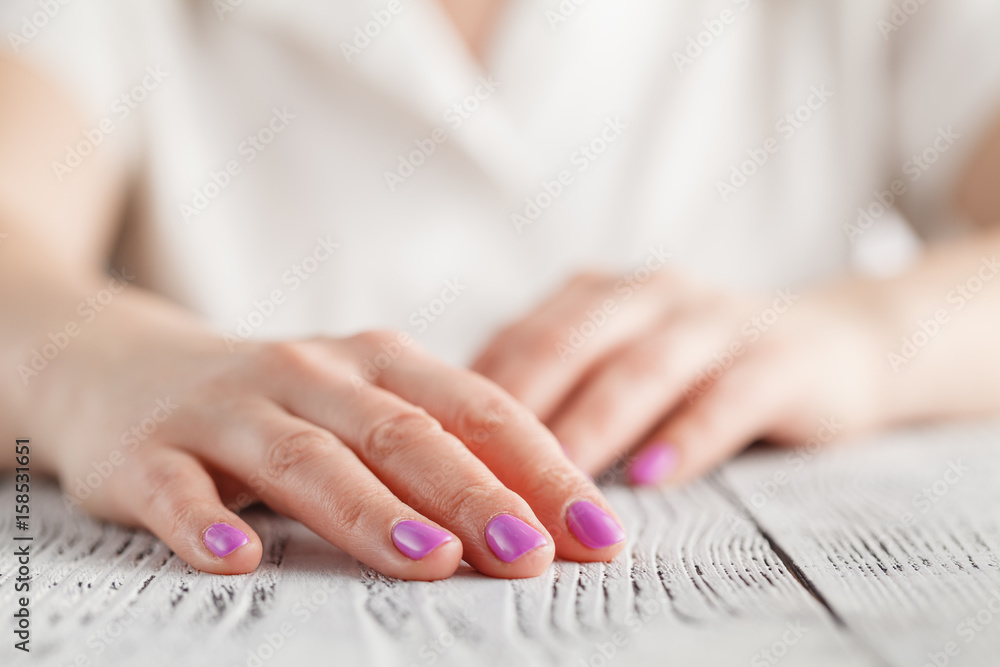 Woman's hands with beautiful manicure on white background.
