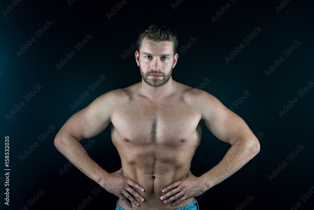 Fototapeta premium strong handsome sexy man with muscular body and serious unshaven face