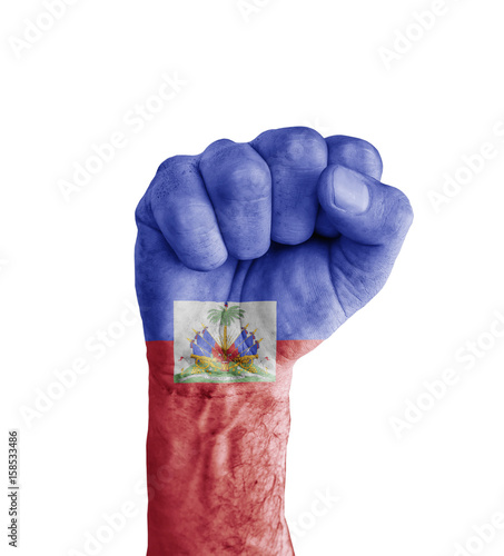 Flag of Haiti painted on human fist like victory symbol