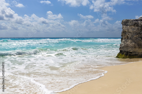 Day in the paradise. An image of an empty beach in the paradise island. The shore of the Caribbean ocean. 