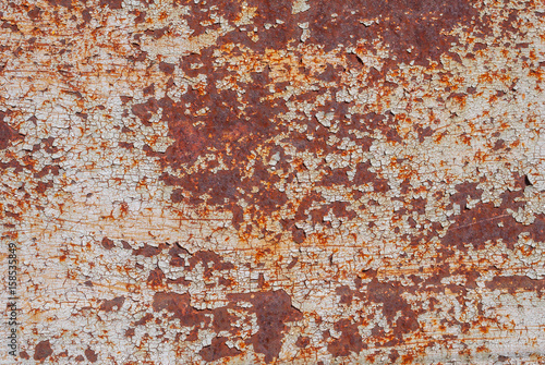 surface of rusty iron with remnants of old paint, chipped paint, texture background © uvisni