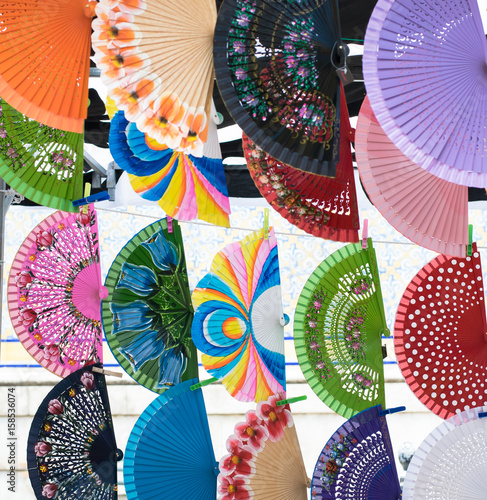 Colorful spanish hand fans for sale in a street market 