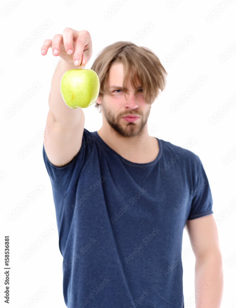 Man with short beard, confident face expression holding apple tail Man with short beard, confident face expression holding apple tail
