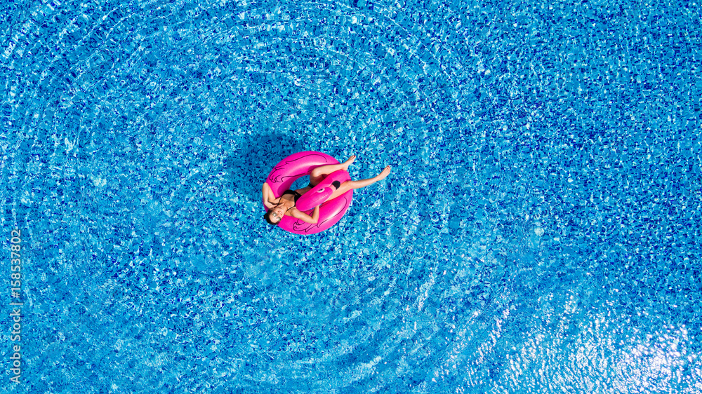 Young girl having fun and laughing and having fun in the pool on an ...