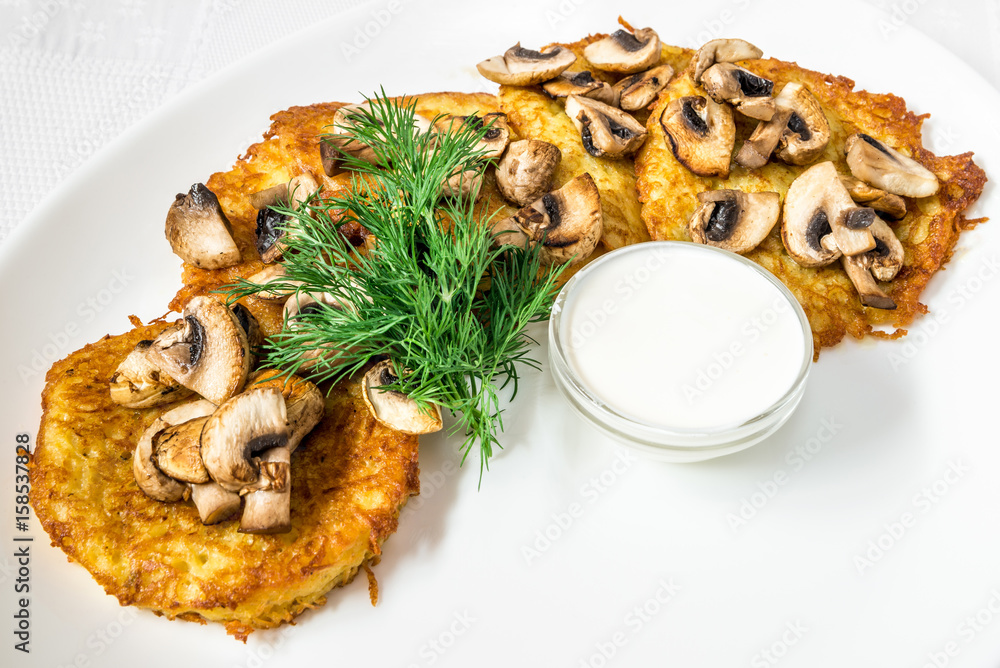 A delicious dish. Cutlets in breading with mushrooms, sauce and dill. Horizontal frame A delicious dish. Cutlets in breading with mushrooms, sauce and dill. Horizontal frame