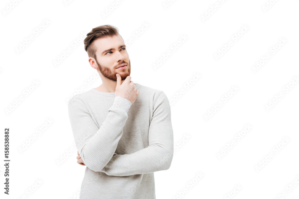 Pensive curious man looking up in thinking pose trying to make choice or desicion isolated Pensive curious man looking up in thinking pose trying to make choice or desicion isolated