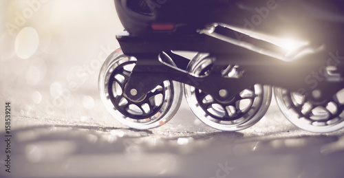 фотографія Road and wheels of roller skates closeup