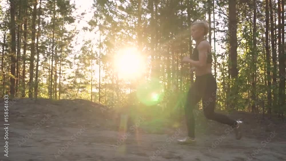 young girl finished training and is happy with her achievements. Female athlete running uphill at dawn. slow motion young girl finished training and is happy with her achievements. Female athlete running uphill at dawn. slow motion