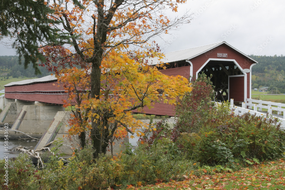 Old red covered bridge located in Beauce, Quebec Canada. Old red covered bridge located in Beauce, Quebec Canada.