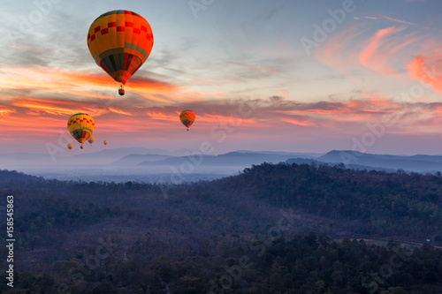 Colorful hot air balloons flying over mountain at Pakse, Laos