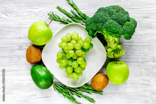 green fresh food for fitness diet on gray wooden table background top view photo