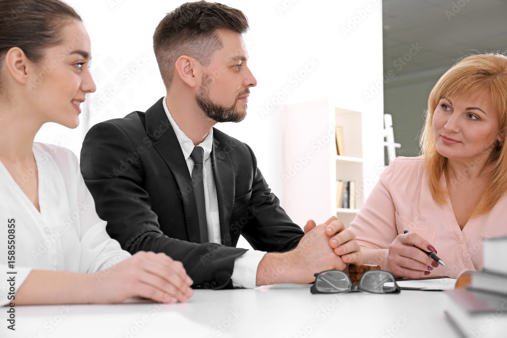 Young couple at notary public office Young couple at notary public office