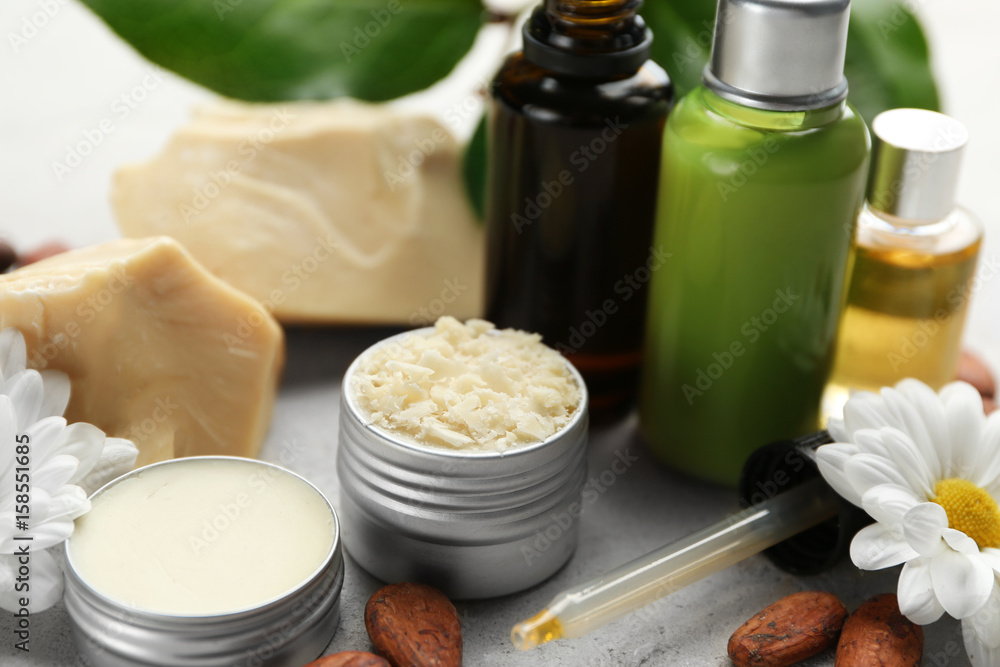 Beautiful composition with cocoa butter lotion on table Beautiful composition with cocoa butter lotion on table