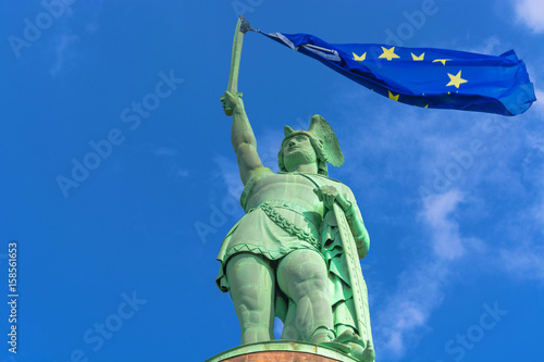 Hermannsdenkmal im Teutoburger Wald mit Europaflagge am Schwert photo