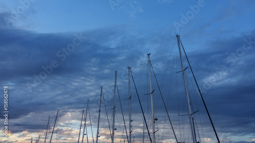 Sailboat mast against a cloudy Sky