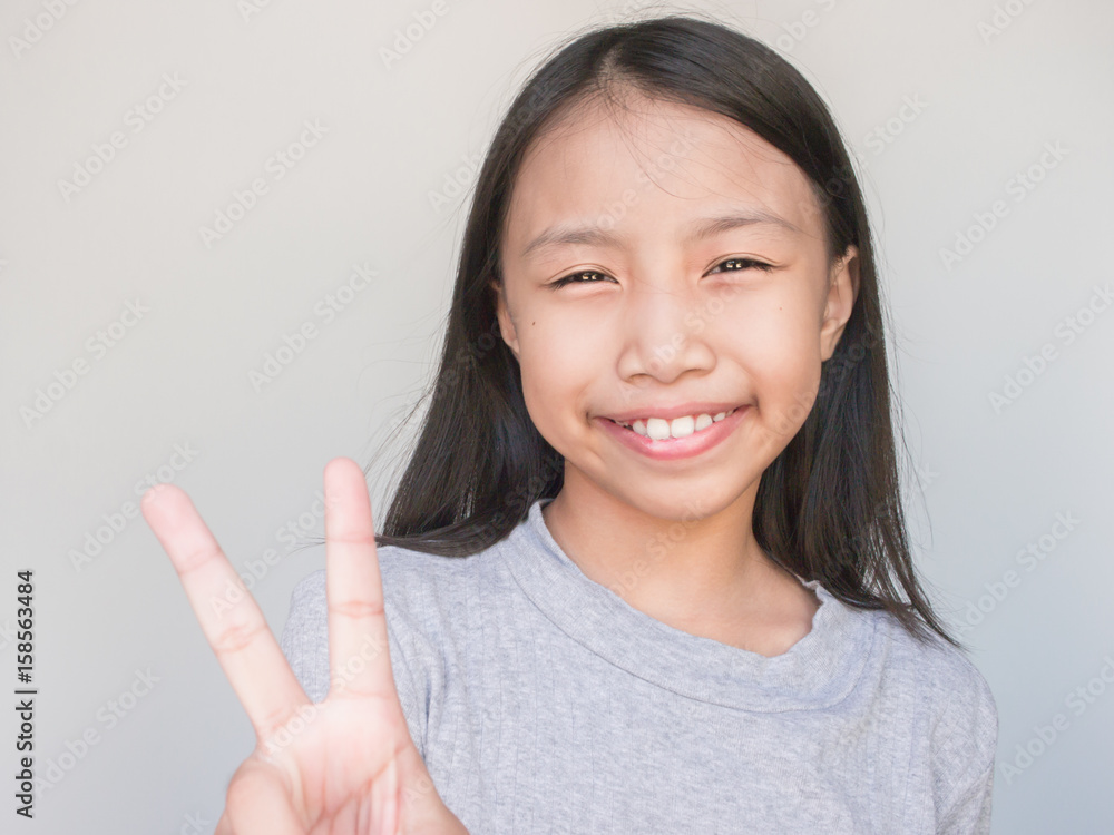 Beautiful girl smile and Show two finger. Beautiful girl smile and Show two finger.
