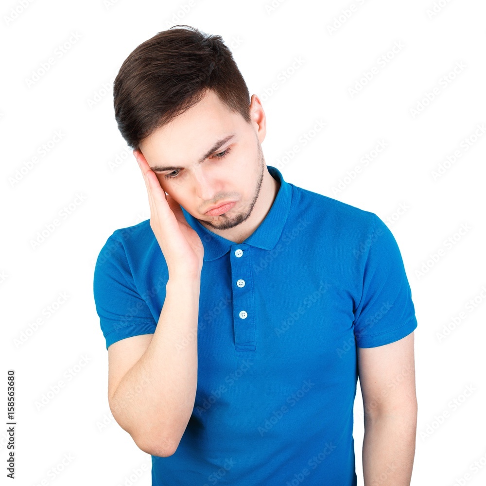 Frustrated businessman with a headache - isolated over white. Terrible headache. Frustrated young man touching his head with hands. Frustrated businessman with a headache - isolated over white. Terrible headache. Frustrated young man touching his head with hands.