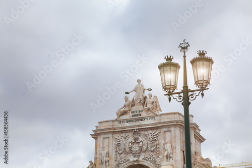 Old street lamp in Lisbon, detail of an old lighting in the city.