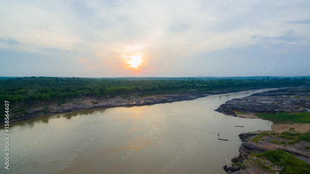 aerial photography around grand canyon in Mekong river. 3000 bok mean 3000 holes,holes eroded into the rock along Mekong river. color of water inside the holes after low tide is emerald green
