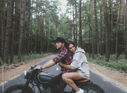 Caucasian couple on motorcycle