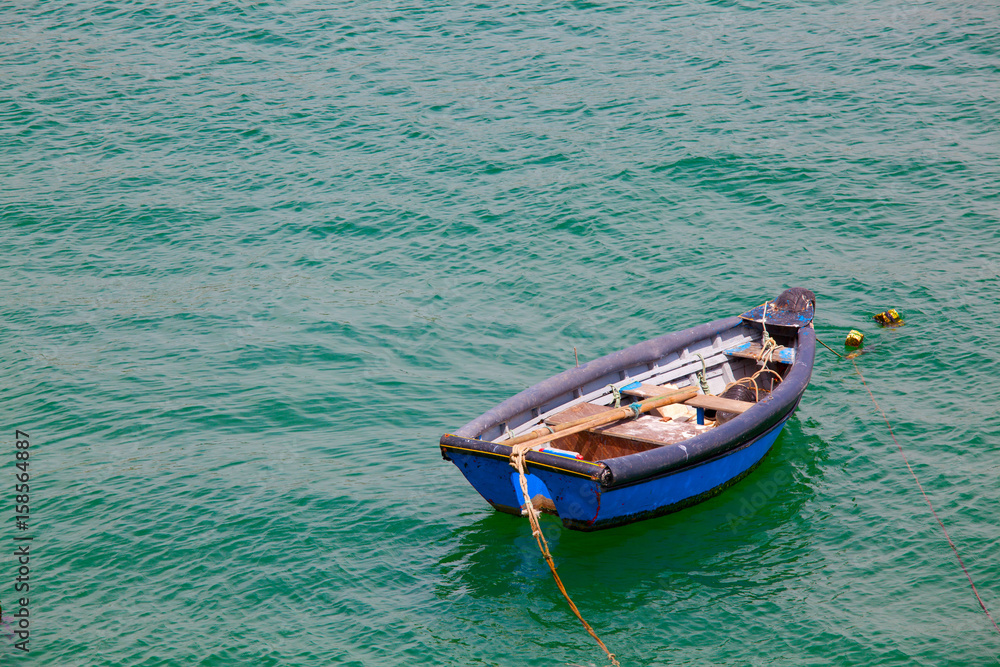 Boat on calm sea  in Cascais Bay, Cascais, Portugal