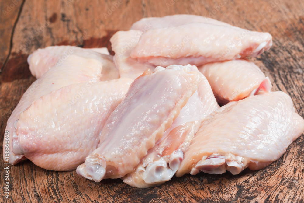 Fresh Chicken wing isolate on wooden table
Fresh Chicken wing isolate on wooden table