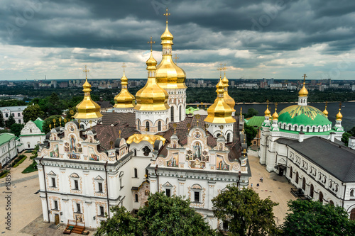 picturesque view of cupolas of Kyiv Pechersk Lavra monastery from bell tower, Ukraine