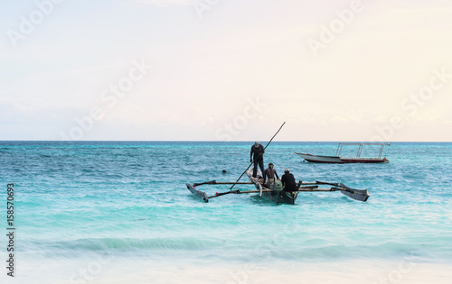 beautiful colorful seascape with fishing boats and fishermen, Zanzibar